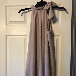 •Sleeveless lavender tunic•